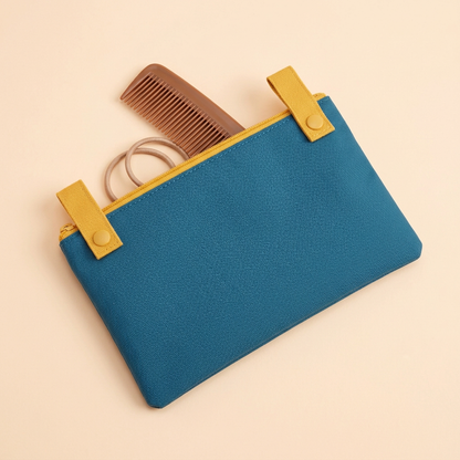 AI concept close-up of the small blue pouch with generic grooming props, not included.