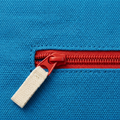 AI concept close-up of red zipper and cream fabric pull on azure envelope.