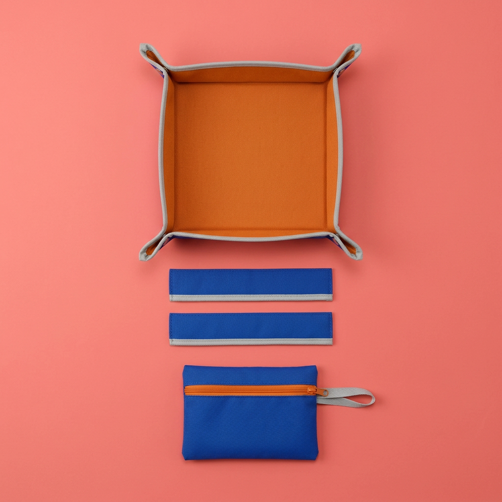 AI concept overhead four-piece organizer layout on coral background.