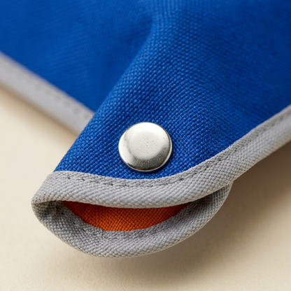 AI concept macro of silver corner snap, blue textile and gray binding.