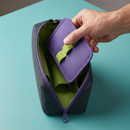 AI concept hand removing the violet cable wallet from charcoal pouch.